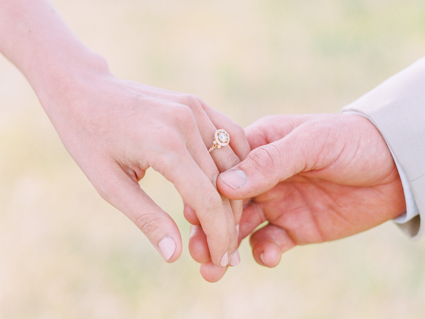 engagement-ring-holding-hands