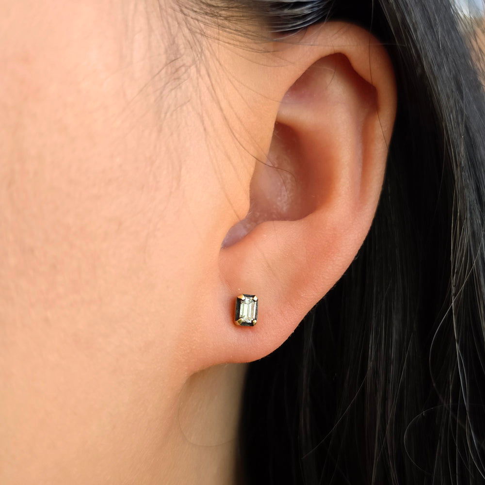 Woman wearing Afterimage diamond stud earrings by Todd Pownell from Alara Jewelry