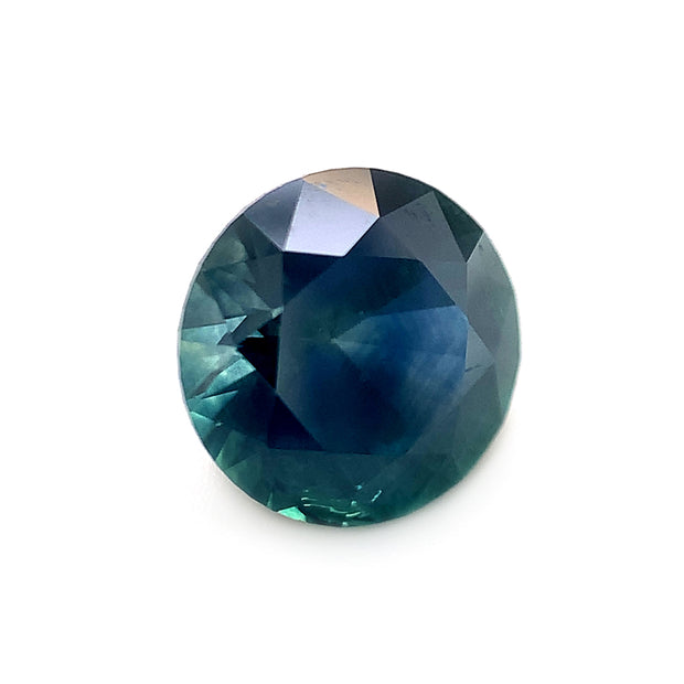 Deep teal round loose Montana Sapphire side