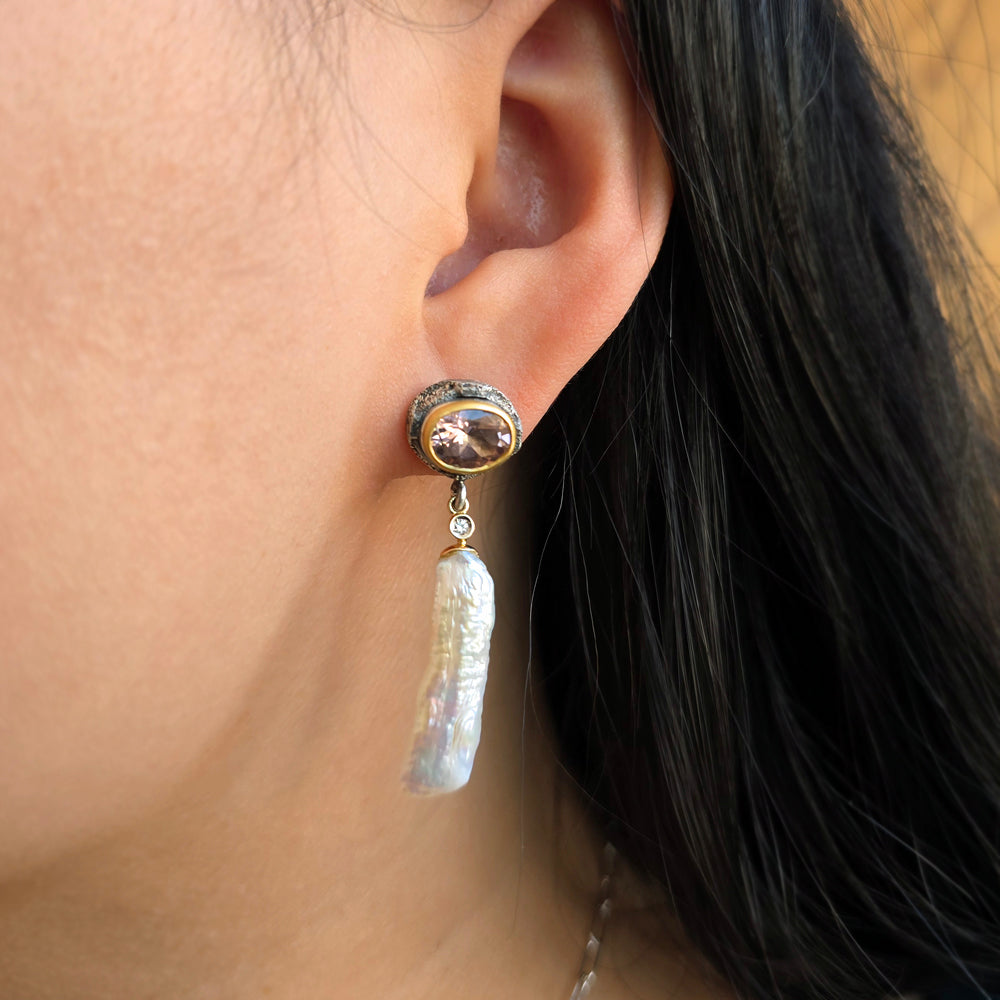 Woman wearing pink tourmaline and freshwater pearl drop earrings from Alara Jewelry