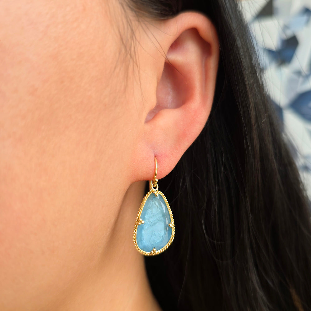 Woman wearing Sea Through aquamarine earrings by Amáli from Alara Jewelry