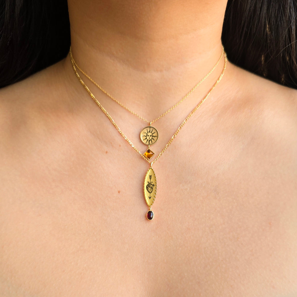Woman wearing Pocketful of Sunshine citrine pendant and others by Anna Bánkuti from Alara Jewelry