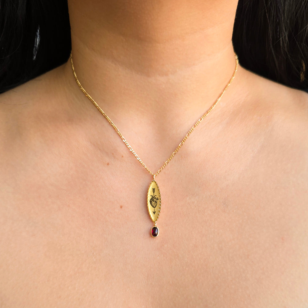 Woman wearing Bleeding Heart garnet pendant necklace by Anna Bánkuti from Alara Jewelry