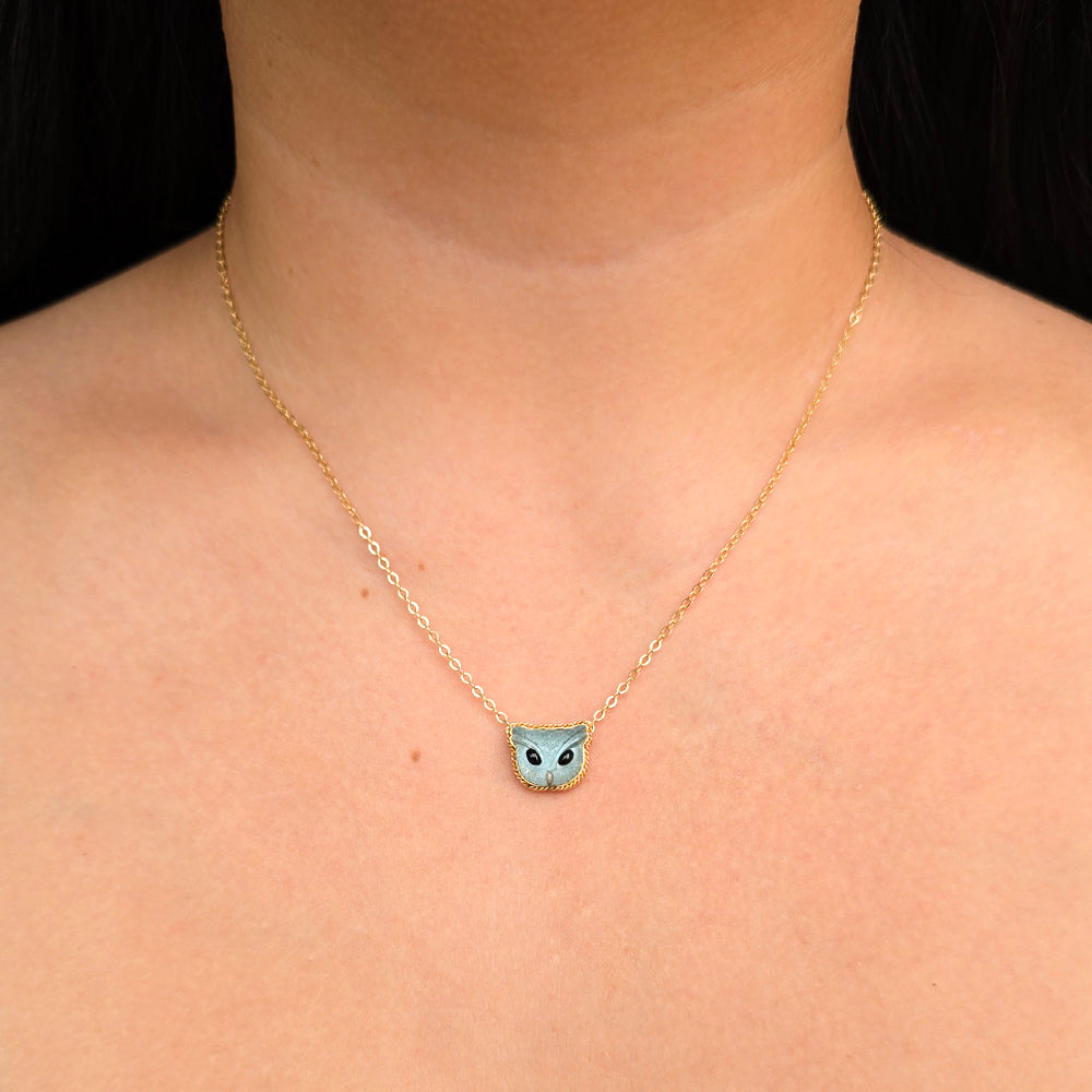 Woman wearing Blue Familiar aquamarine necklace by Amáli from Alara Jewelry