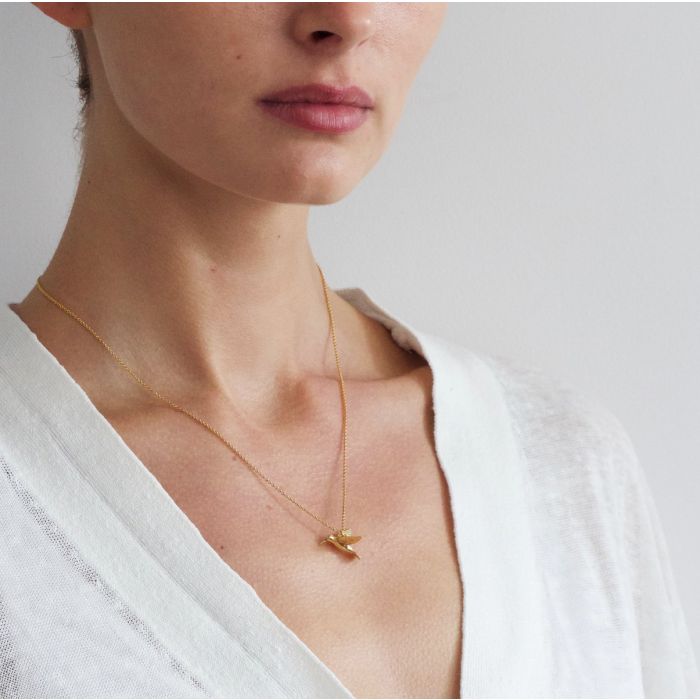 Woman wearing hummingbird pendant necklace by Alex Monroe from Alara Jewelry