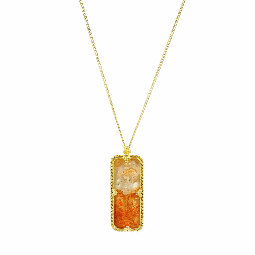 Close-up of sunstone showing peach, rust, and orange color zoning