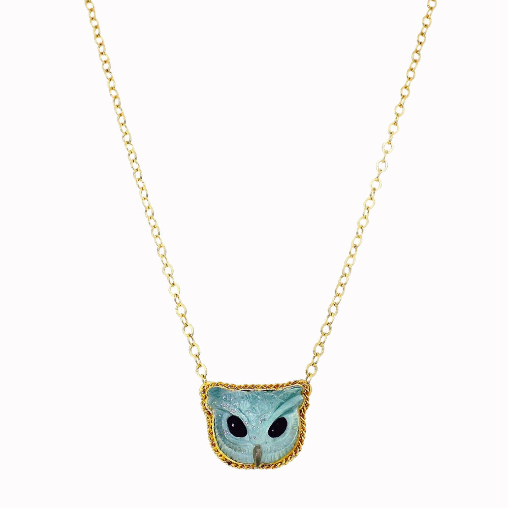 Blue Familiar carved aquamarine necklace by Amáli in 18K gold