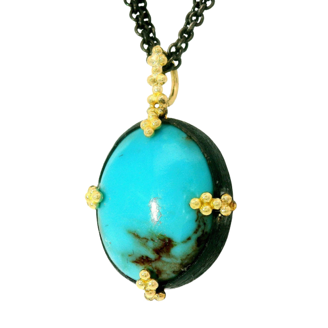 Blue Mesa turquoise necklace in oxidized silver with 18K gold prongs