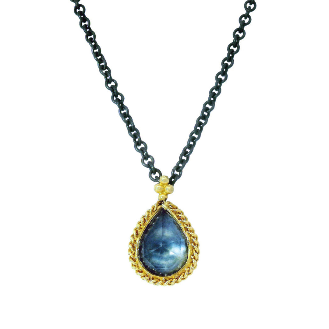 Pear-shaped rose cut Montana sapphire pendant with gold beaded bezel