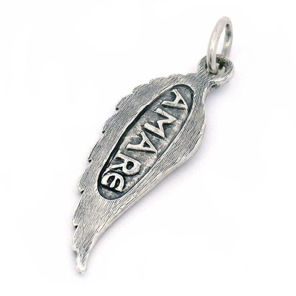 Silver pendant with 'AMARE' engraving on a white background