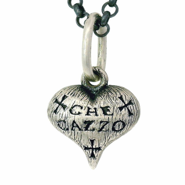 hand-carved heart charm by Erica Molinari from Alara Jewelry
