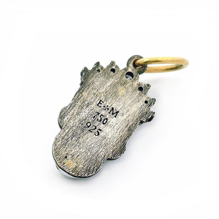Back of Relic skull pendant by Erica Molinari with diamond tiara and gold accents