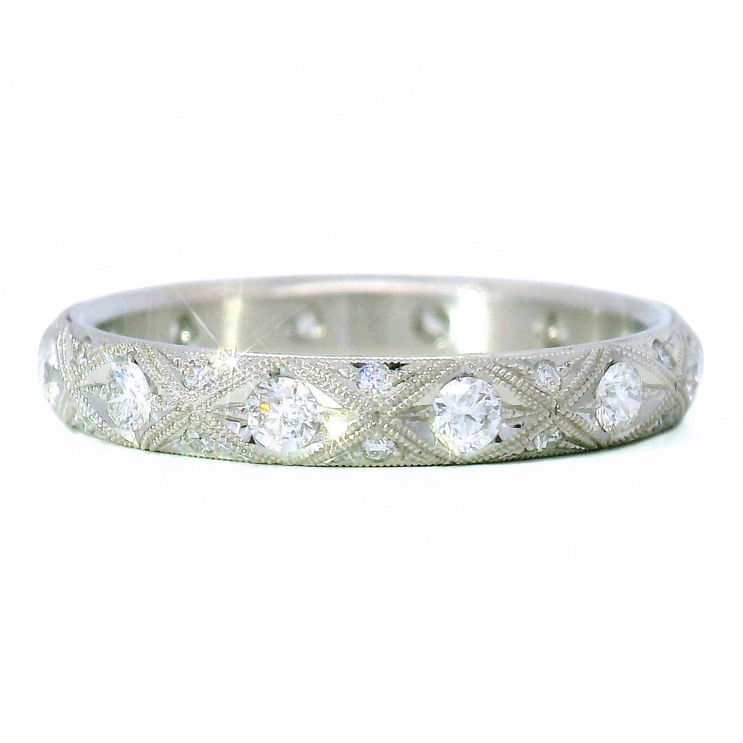 Geometric diamond wedding band in platinum with beaded edges