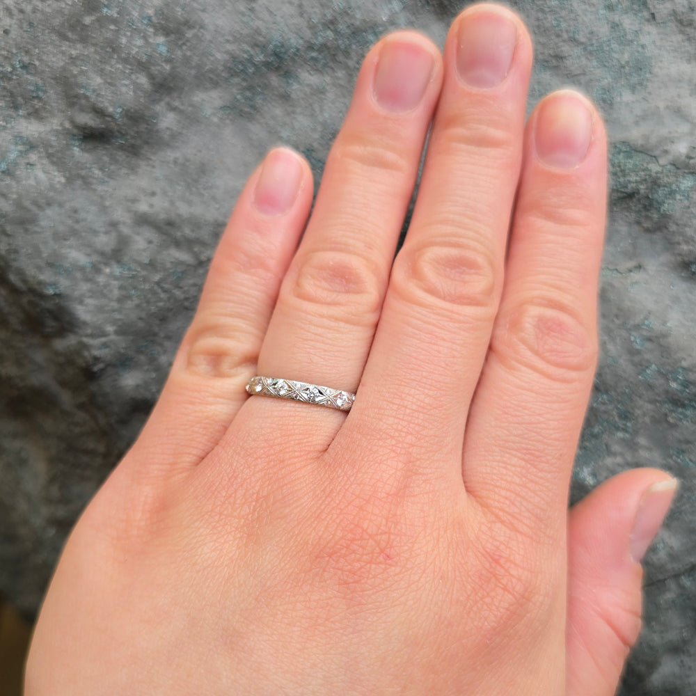 Woman wearing Serpentis platinum diamond eternity band from Alara Jewelry