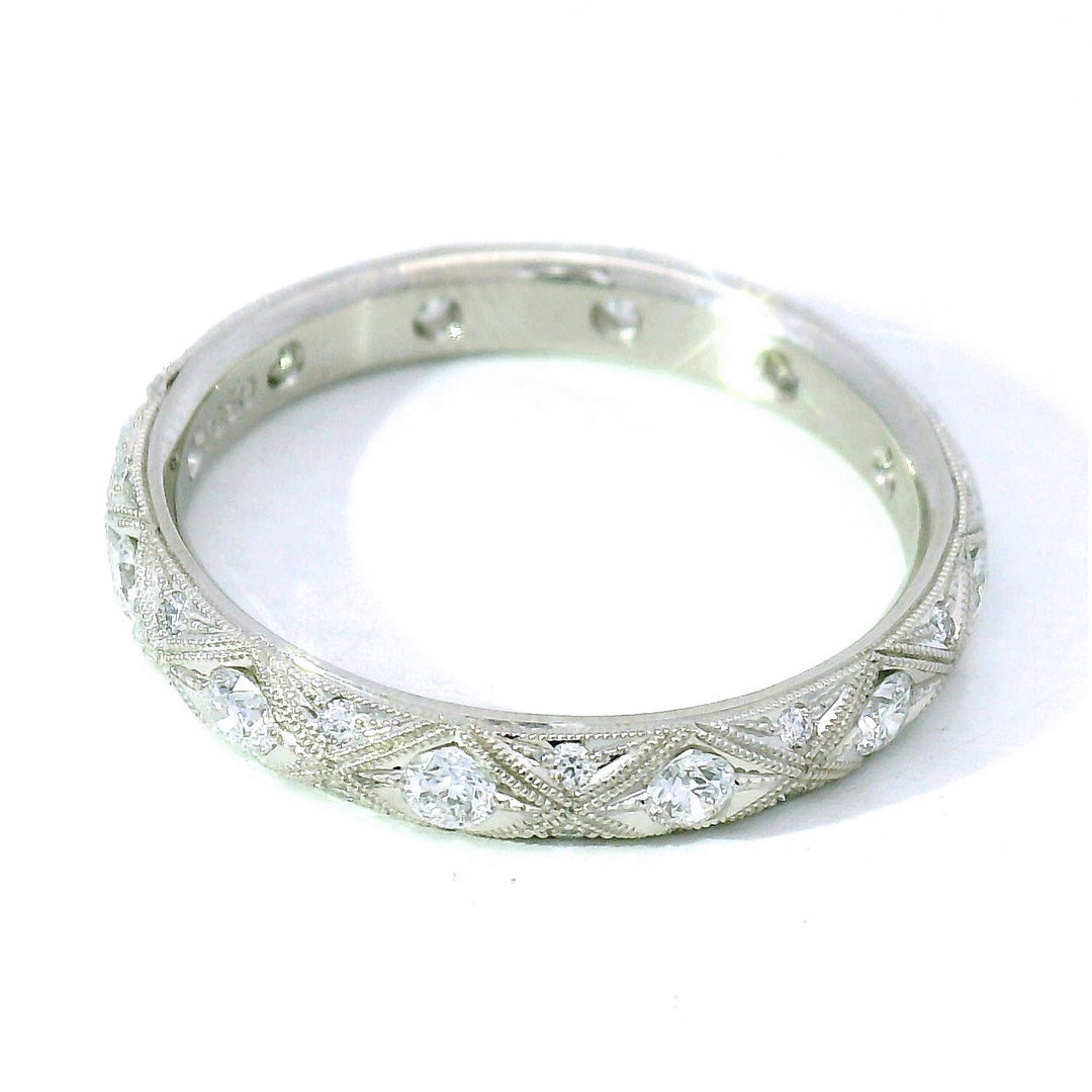 Serpentis platinum diamond eternity band with milgrain detail