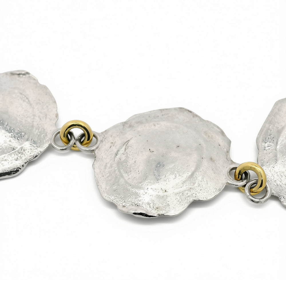 Impact-inspired textured link bracelet with gold jump ring accents