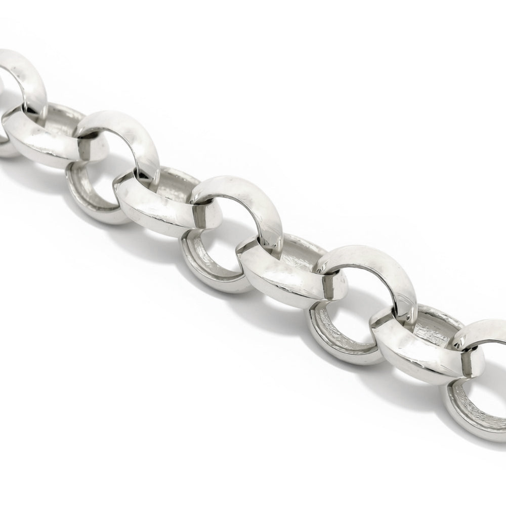 Close-up of faceted hand-worked texture on sterling silver bracelet link