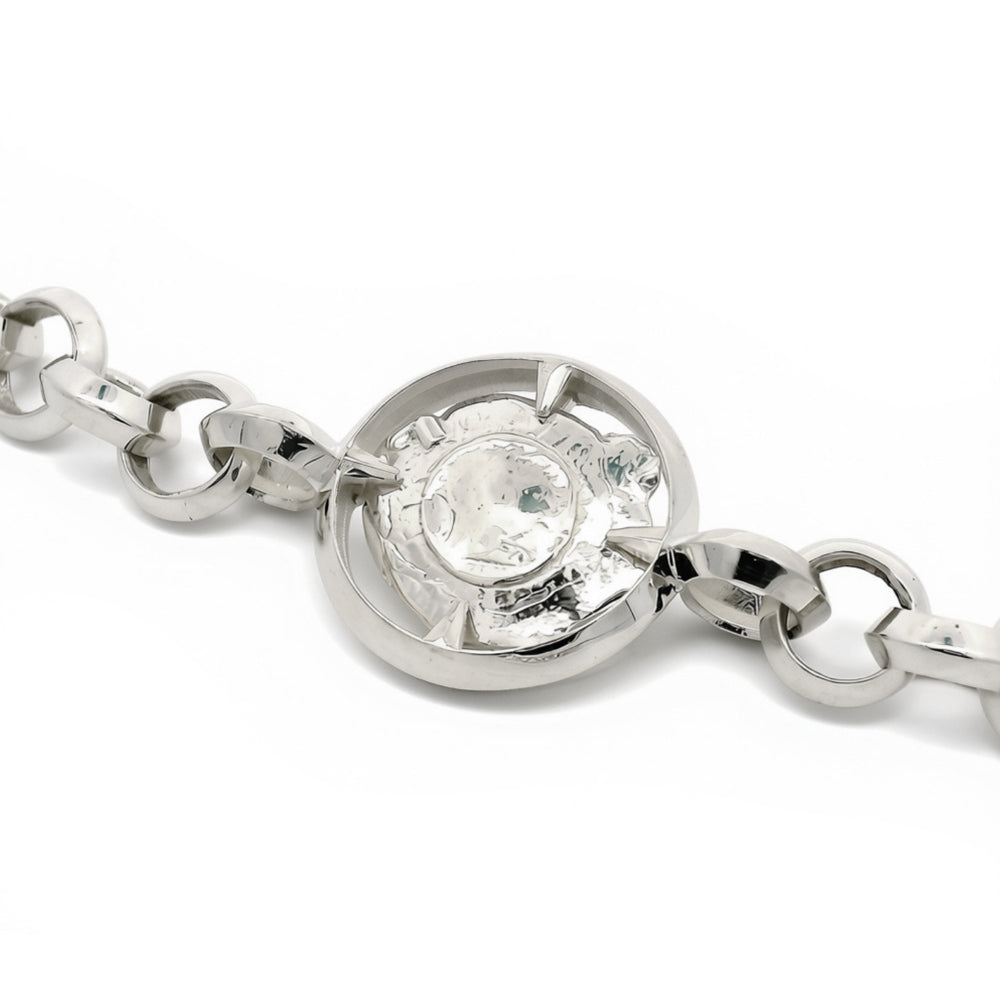 Close-up of sculptural centerpiece on Ricochet sterling silver bracelet
