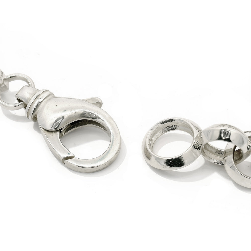 High-polish silver link bracelet with cast centerpiece detail