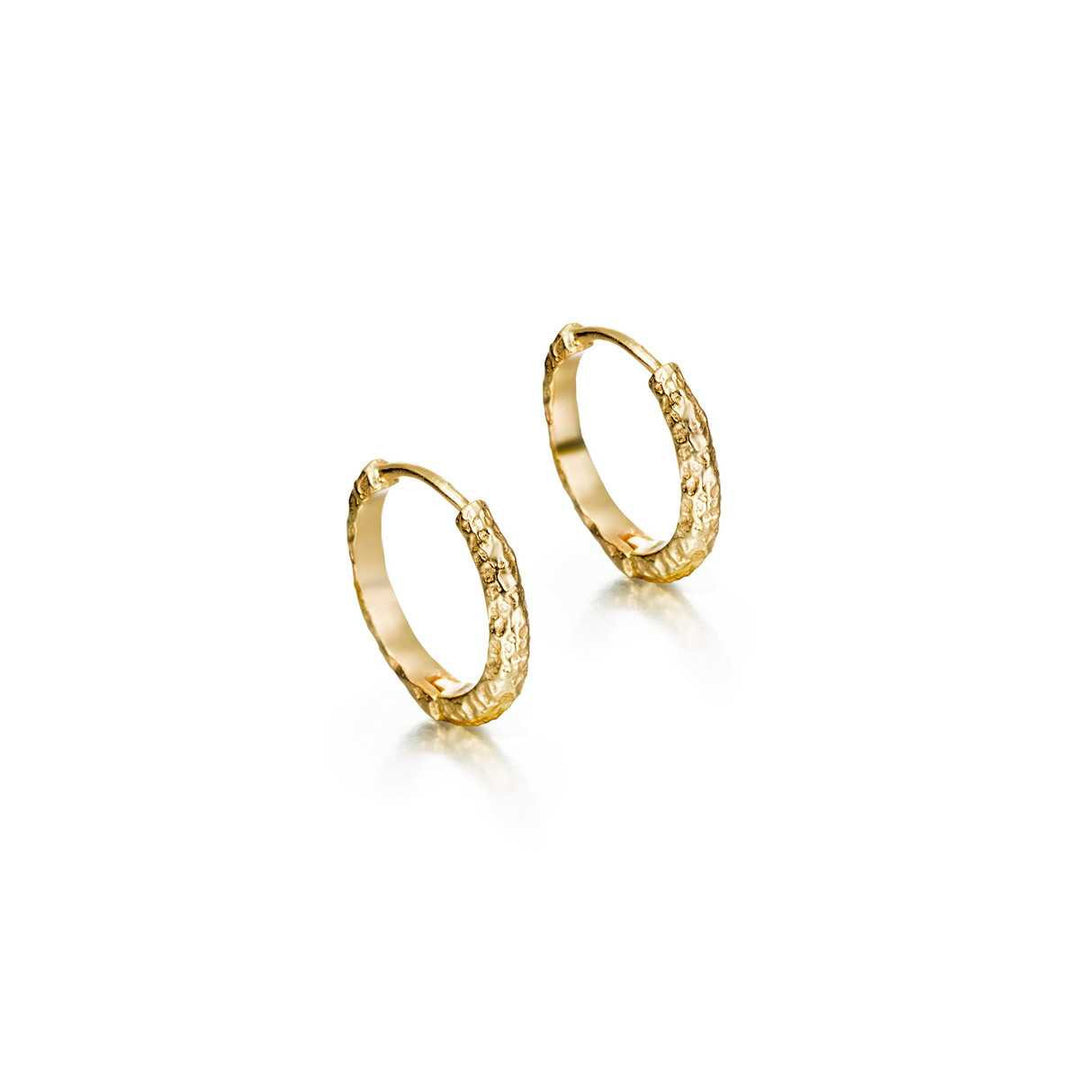 Medium Lava Collection textured gold vermeil huggie hoops by Jorge Revilla
