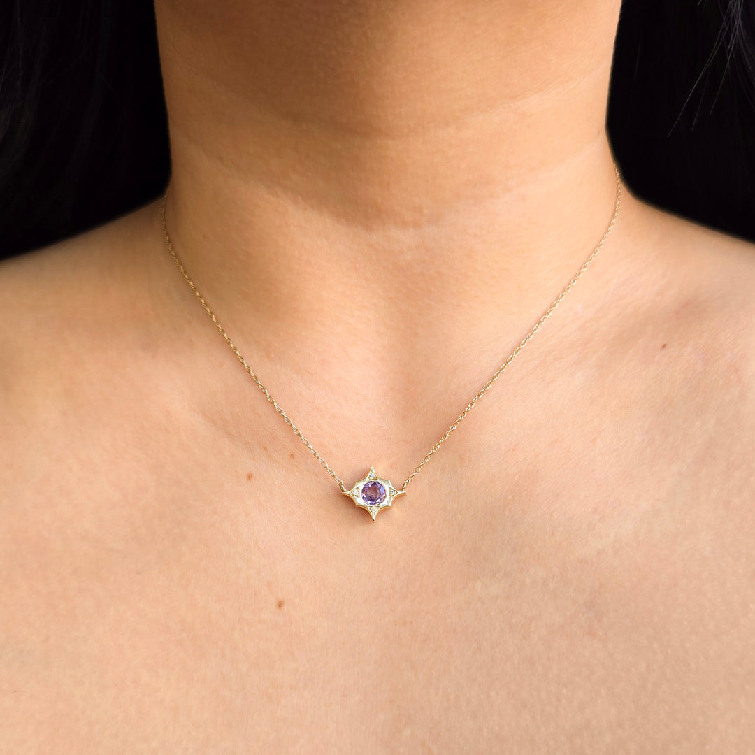 Worn round purple sapphire and diamond detail on pendant