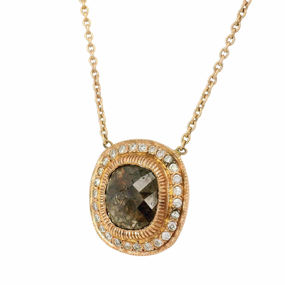 Close-up of rose-cut diamond and accent diamonds on medallion pendant