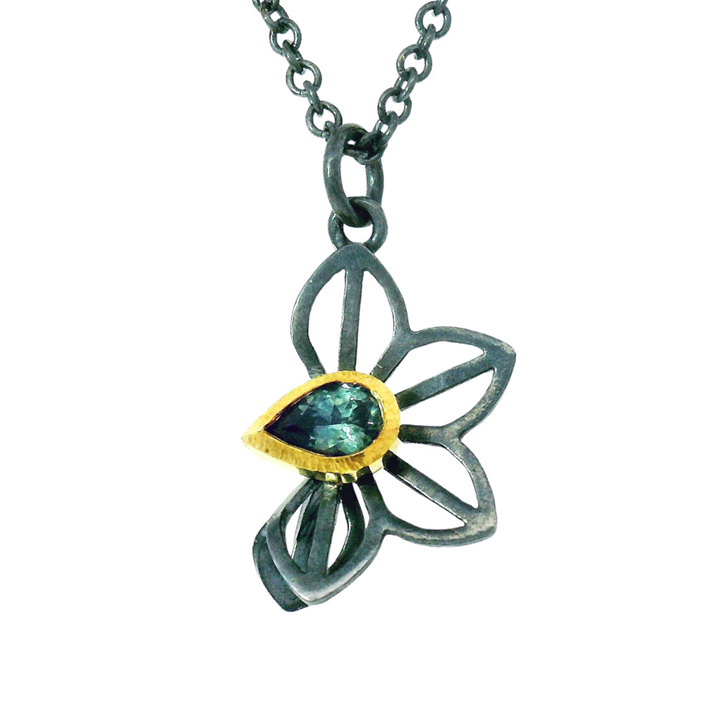 Anise Fold pendant with green pear-shaped sapphire and openwork silver petals