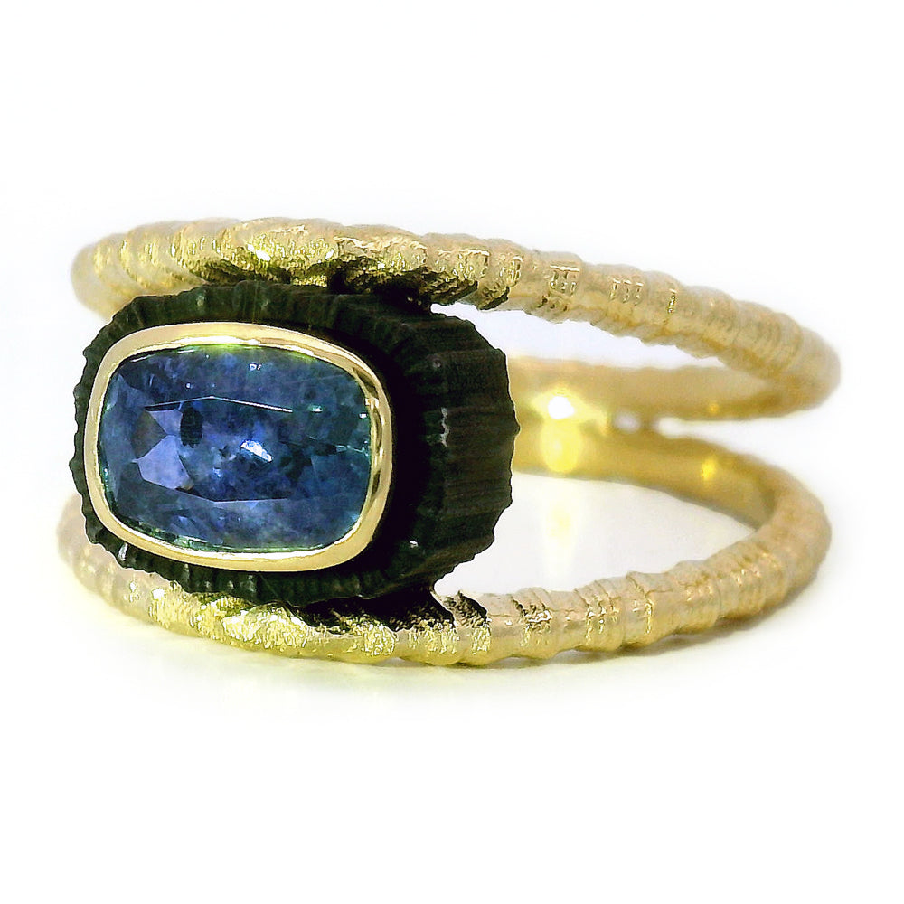 East-west set blue Montana sapphire ring with split shank design