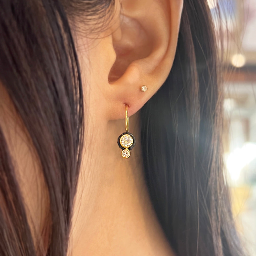 Woman wearing Chroma diamond drop earrings by Sarah Graham from Alara Jewelry