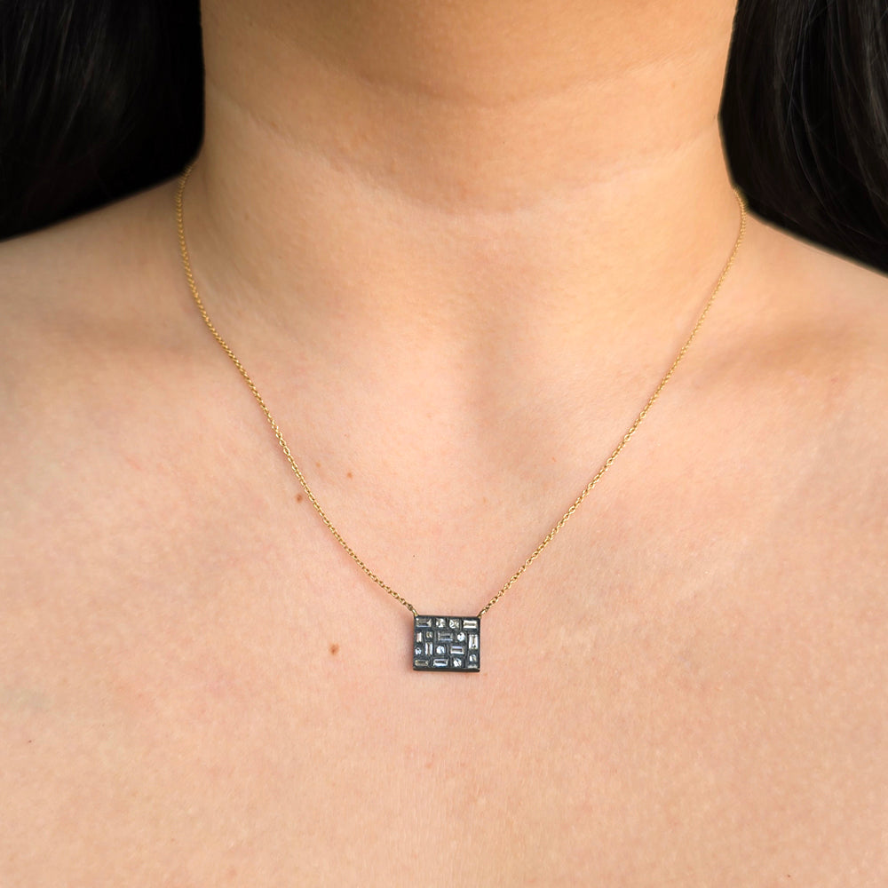 Woman wearing City Lights diamond pendant necklace from Alara Jewelry