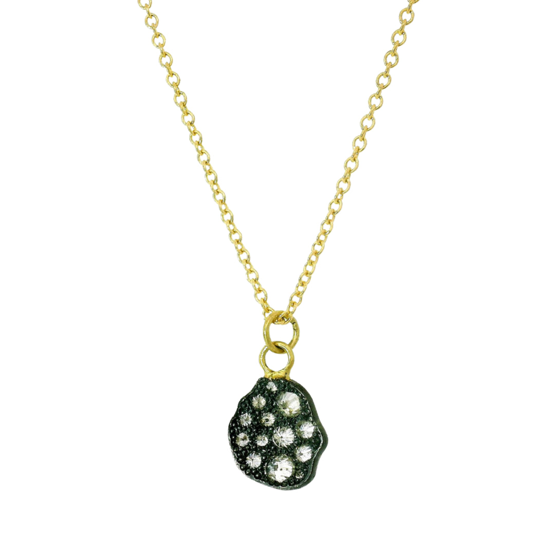 Close-up of inverted diamonds set in oxidized silver pendant