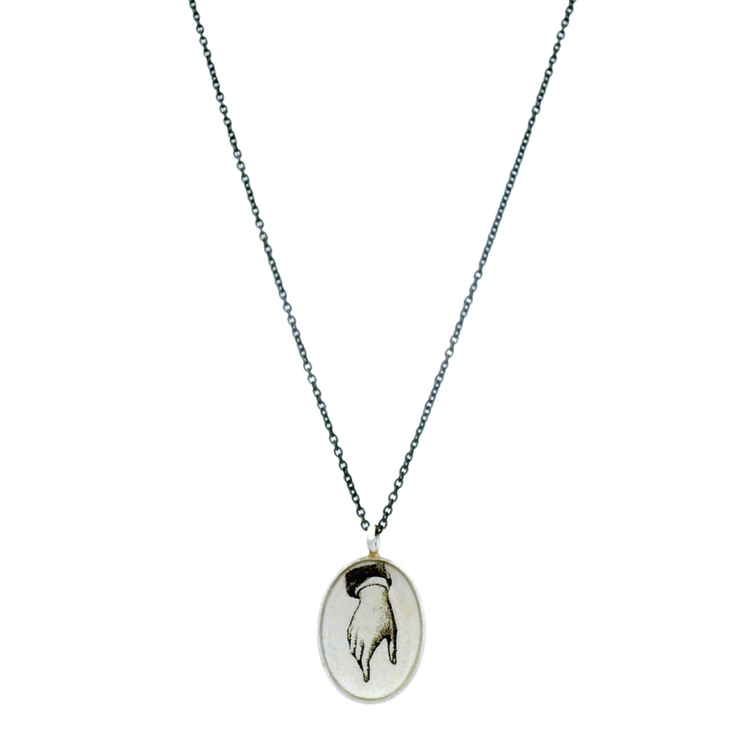 Guiding Hand pendant necklace by Anna Bánkuti in oxidized sterling silver
