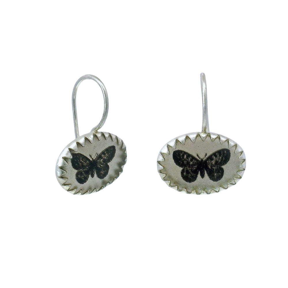Etched butterfly drop earrings with darkened detail and kidney wires