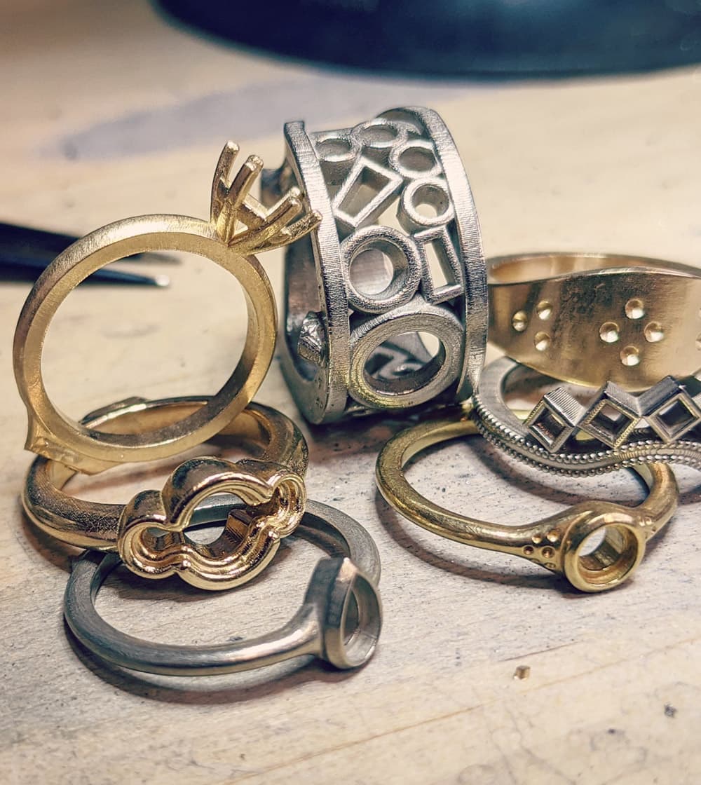Unique custom ring settings in gold and silver.