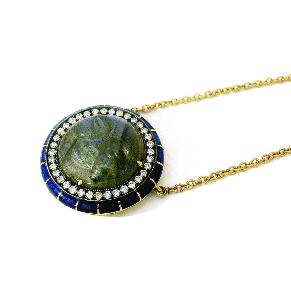 Necklace with a green stone moon face pendant on a white background