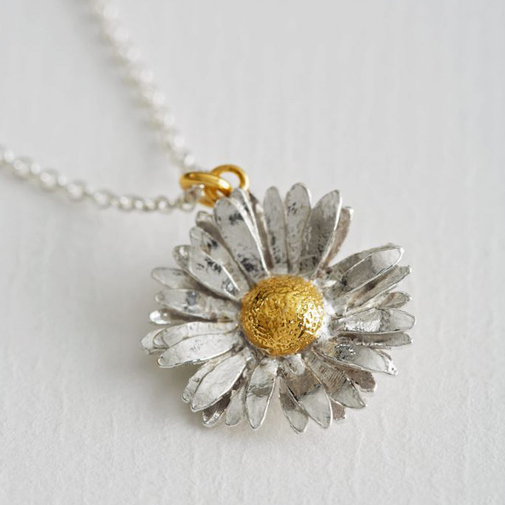 Daisy Necklace, is made from sterling silver and gold vermeil