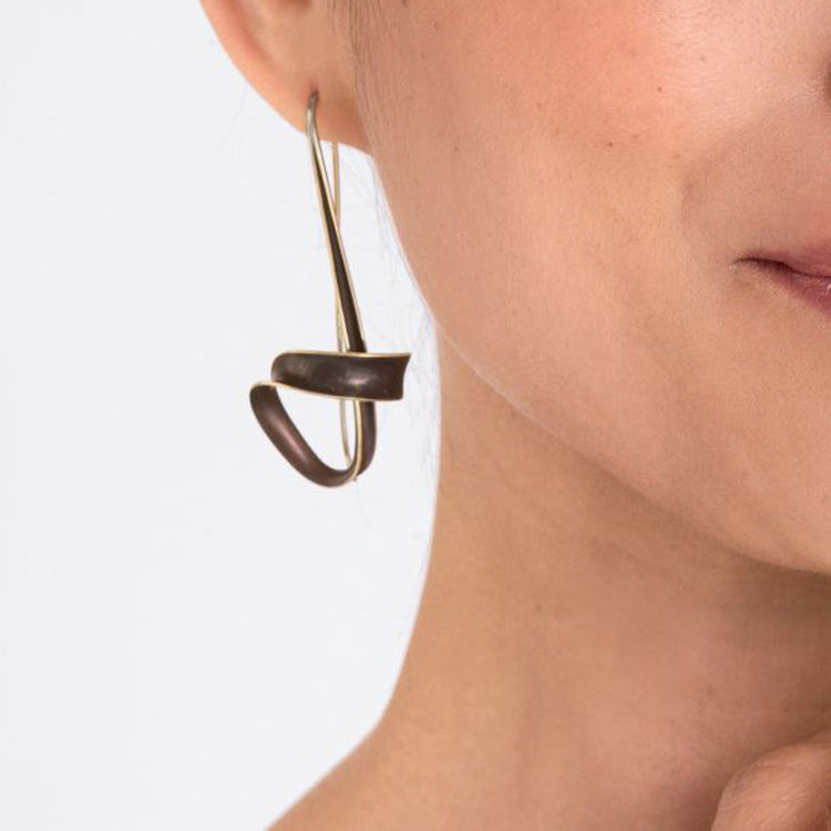 Nancy Linkin bronze flourish earrings on model
